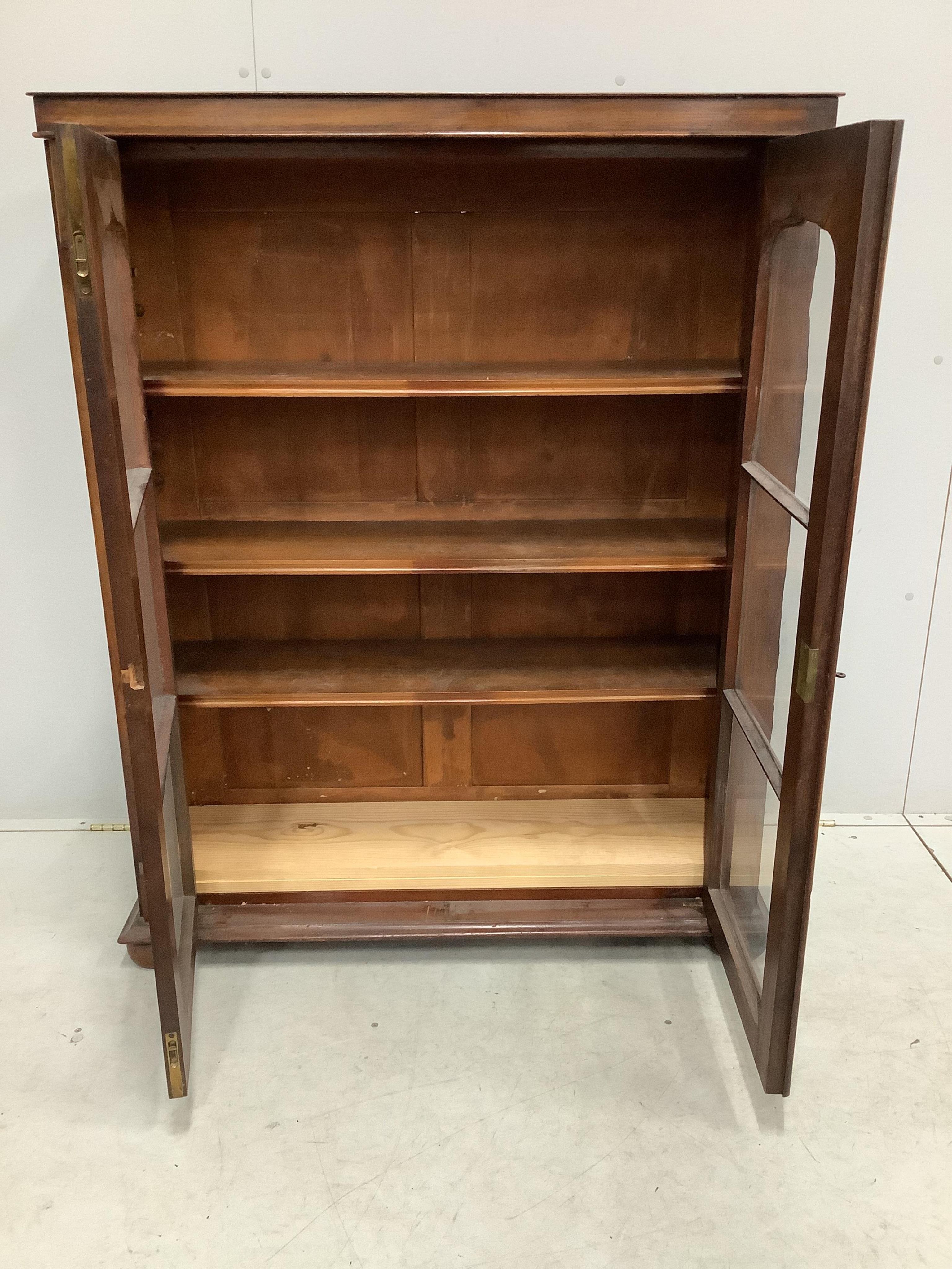 An early Victorian mahogany bookcase, (adapted), width 100cm, depth 30cm, height 127cm. Condition - fair